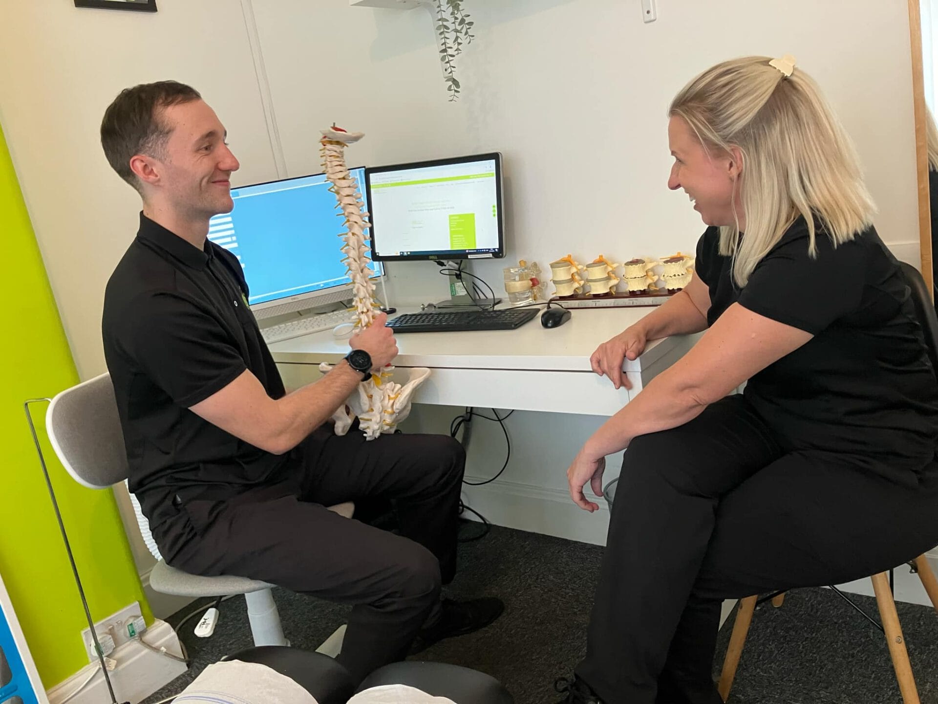 chiropractor and patient discussing spinal treatments